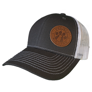 black and white mesh back hat with leather patch and project k-9 hero logo